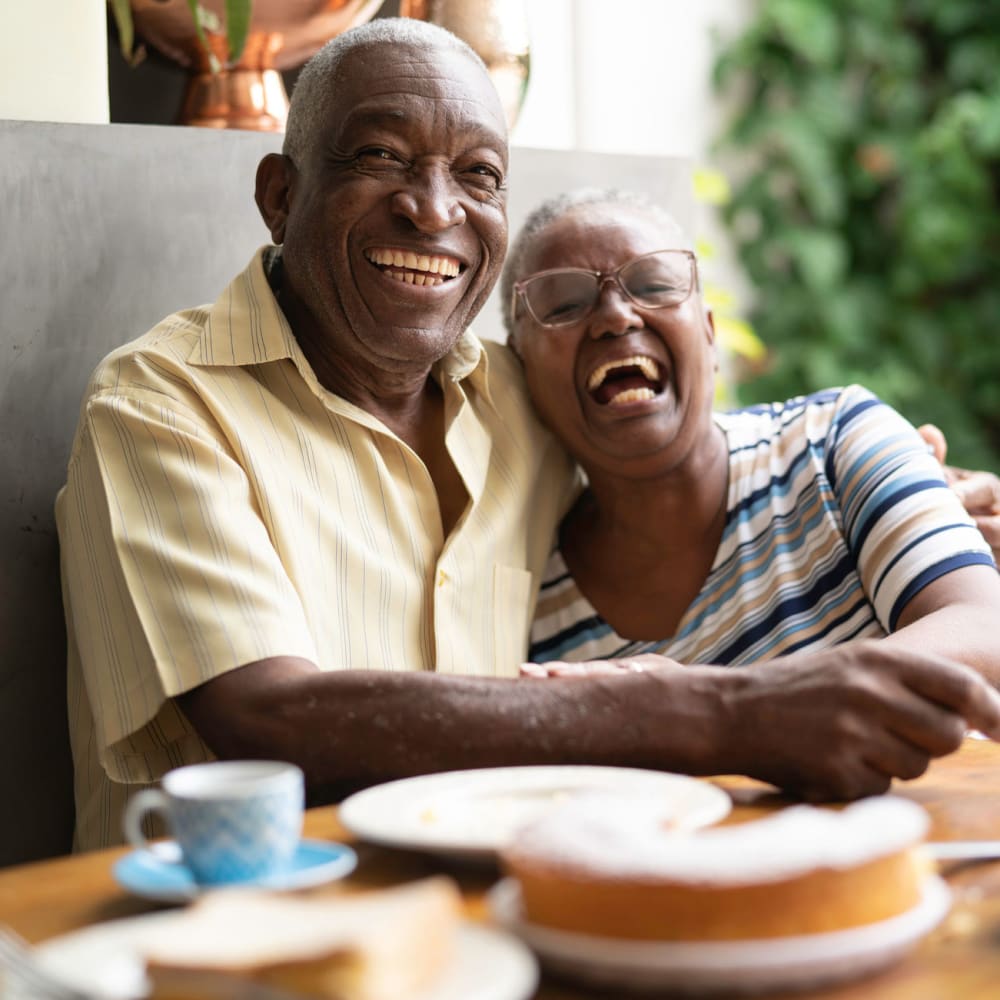 Resident couple hugging and laughing at Randall Residence of Troy in Troy, Ohio