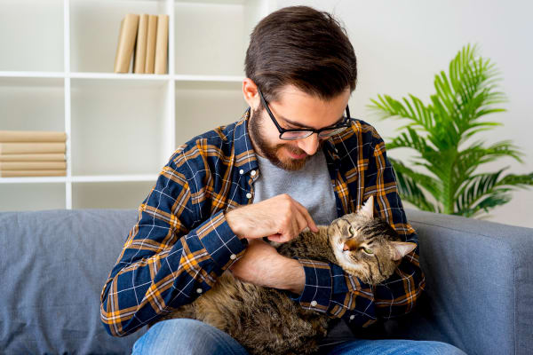 resident and his cat at The Pines at Castle Rock Apartments in Castle Rock, Colorado