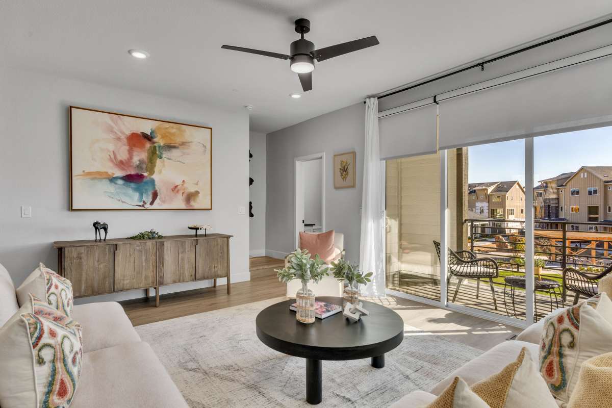Living featuring floor to ceiling windows and natural light 
