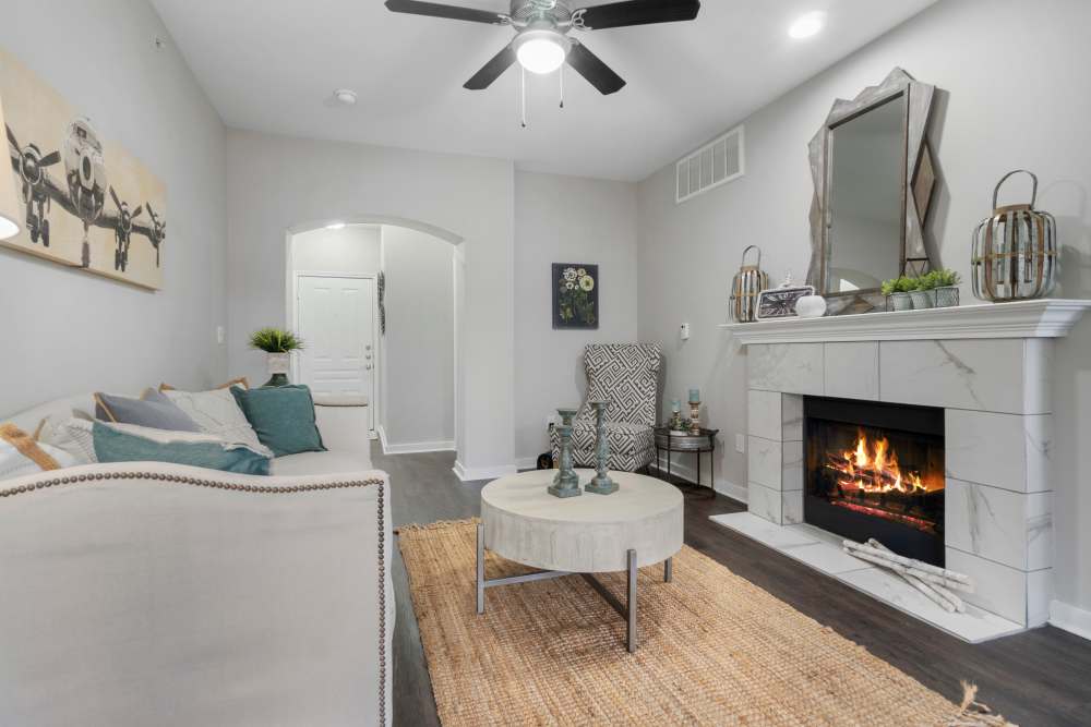 Open layout living room with plenty of room for a couch, coffee table, and more at Flatiron District at Austin Ranch in The Colony, Texas