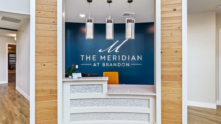 Logo sign in lobby at The Meridian at Brandon