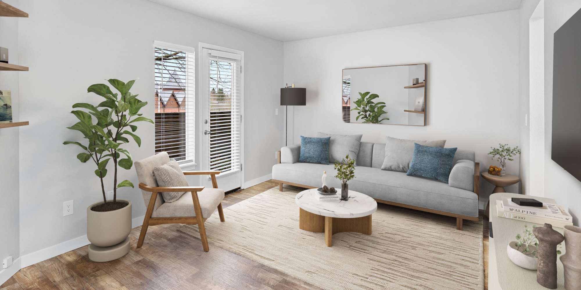 Living room with wood-style flooring and patio at Waterhouse Place in Beaverton, Oregon