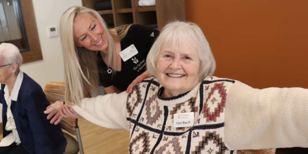 Smiling senior resident and caregiver at The Springs at Bozeman in Bozeman, Montana