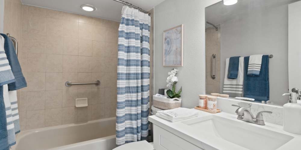 Apartment bathroom with quartz countertops at Waters Pointe in South Pasadena, Florida