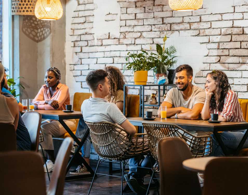Group of friends having coffee near The Garnett in Brooklyn, New York