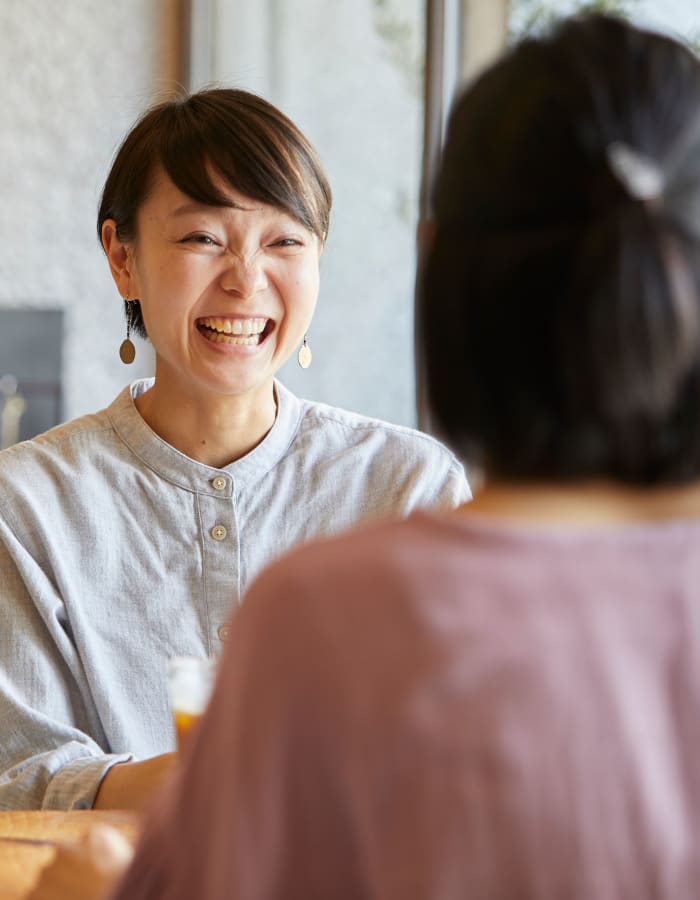 woman smiling with a friend at The Villages in Santa Rosa, California