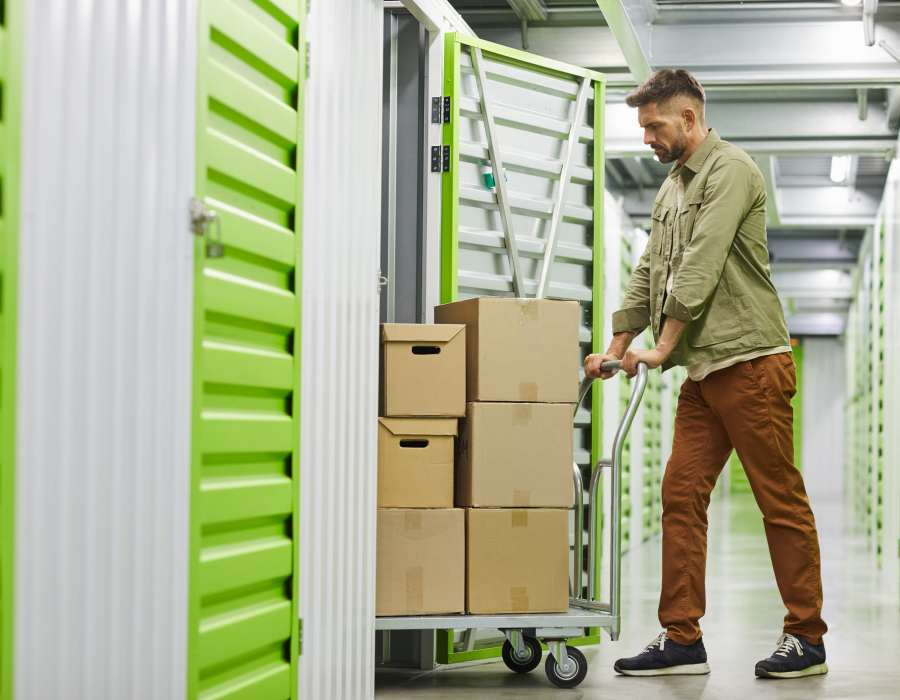 Guy pushing a cart at Storage Hub - Sonterra in San Antonio, Texas 