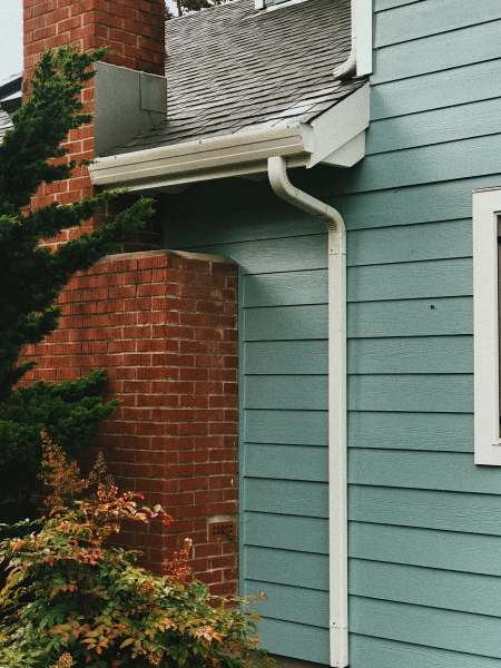 image of gutters and downspout on the side of a house