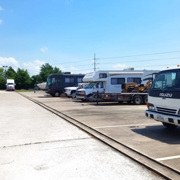 Outdoor parking spaces for RVs, trucks, and trailers at StorQuest Self Storage in Spring, Texas
