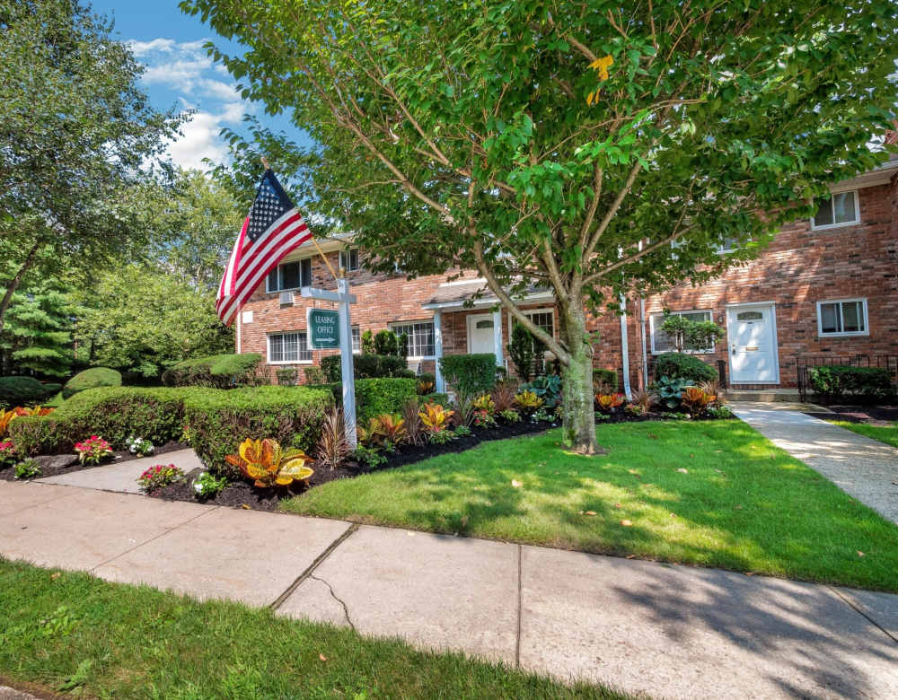 Outdoor Apartment View with Green Lanscaping at Eagle Rock Apartments at Nesconset in Nesconset, New York