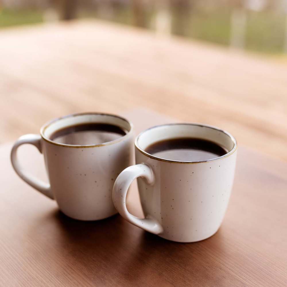 Coffee mugs on a wooden table at Bana At Tujunga in Tujunga, California