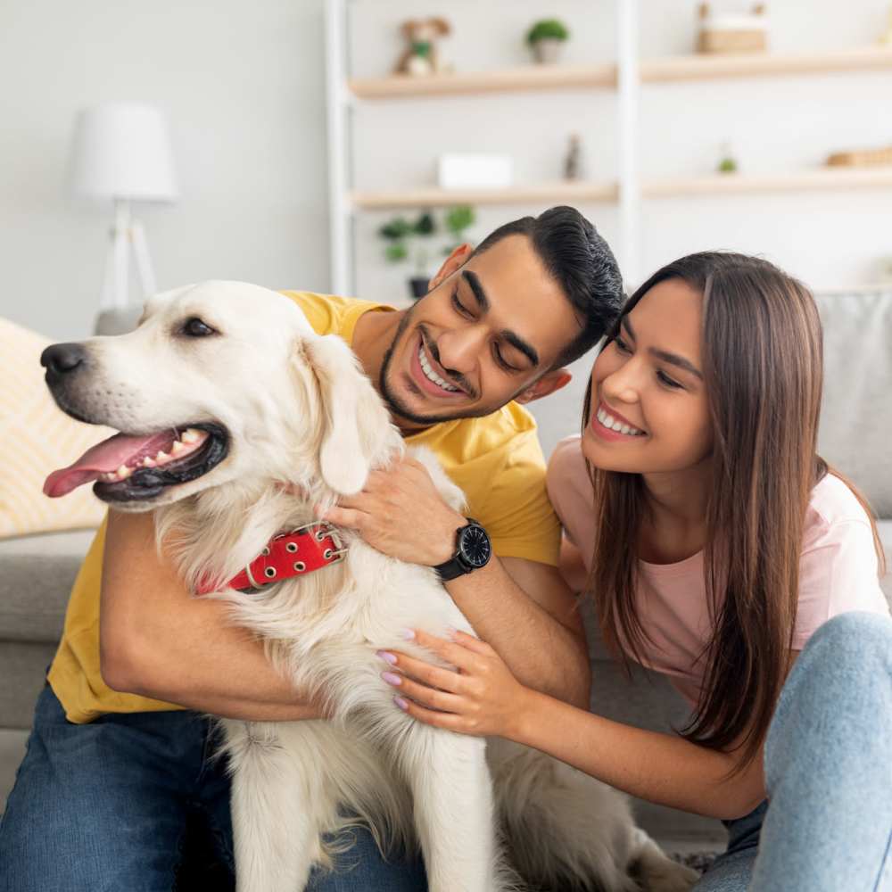 Happy resident couple with their pet dog at Middlebrook Trace II in Staunton, Virginia 