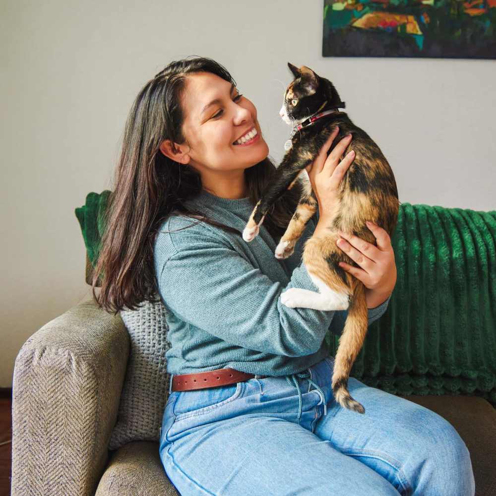 Resident playing with her cat at The Garnett in Brooklyn, New York