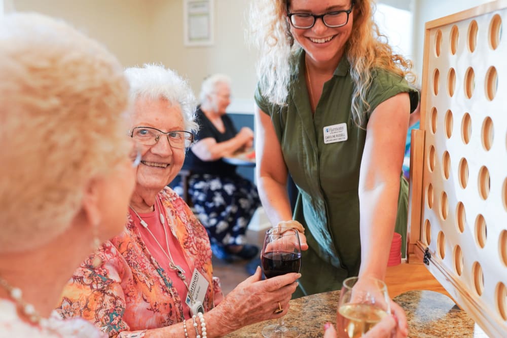 Residents playing games at happy hour Harmony at White Oaks in Bridgeport, West Virginia