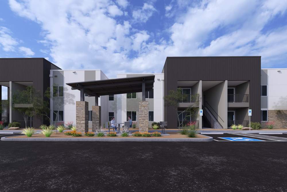 Apartment parking spaces, and contemporary buildings at Wild Rose Flats in Phoenix, Arizona