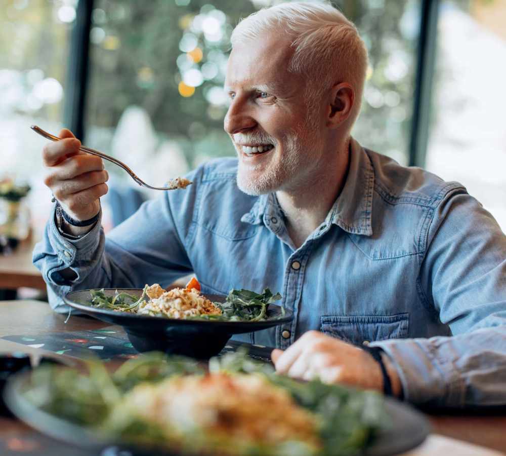 Resident eating dinner at Vintage at Redfield in Reno, Nevada  