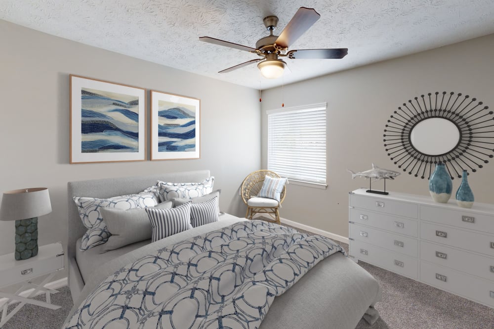 Bedroom with plush carpet at The Retreat at Eddins in Montgomery, Alabama