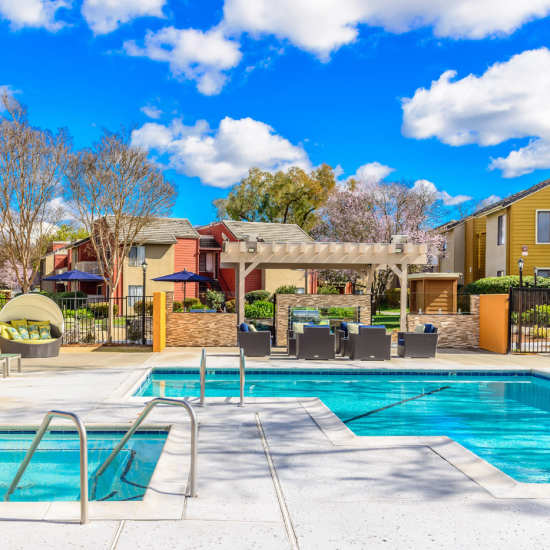 Resort-style pool with lots of seating area at Crossbrook Apartments in Rohnert Park, California