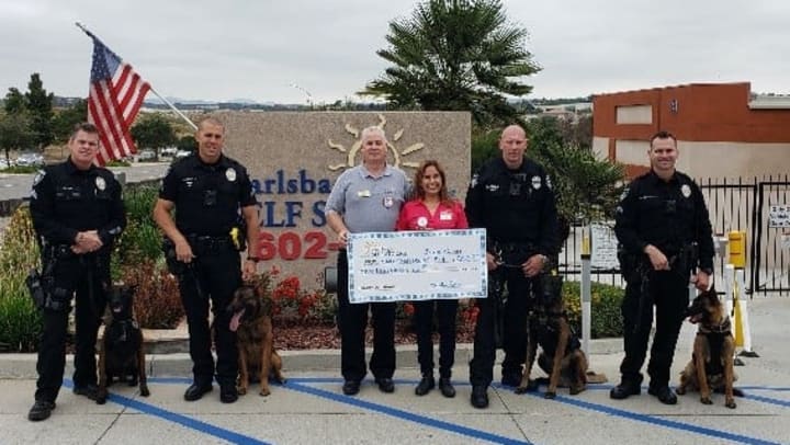 Carlsbad Self Storage presenting check to the Carlsbad Police Department