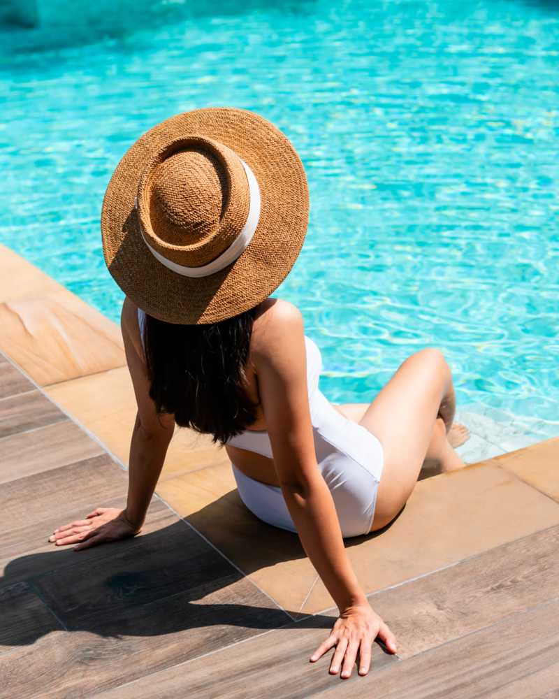 Resident relaxing beside the pool at Eight Mile House in Stockton, California