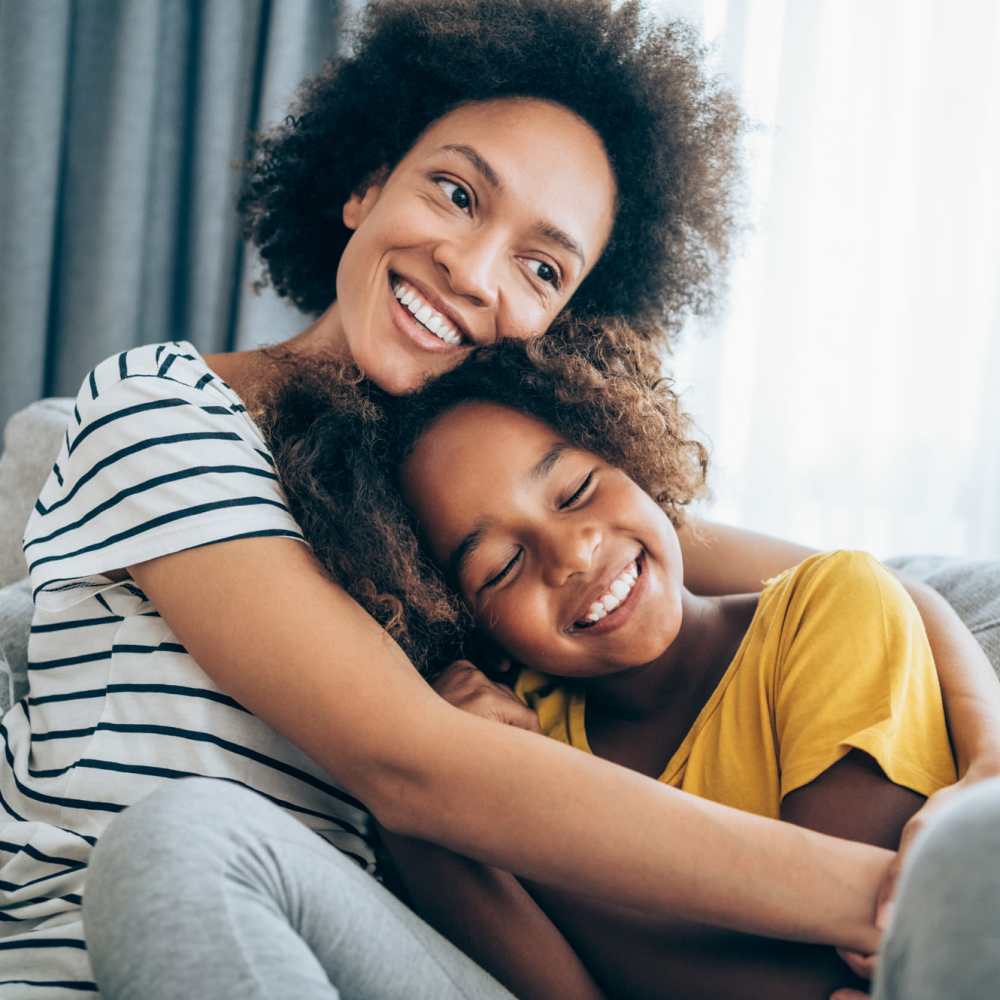 Mother and daughter in living room at Coral Wood Court in Reseda, California