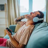 Resident listening music at The Warwick at Foundry Creek in Richmond, Virginia