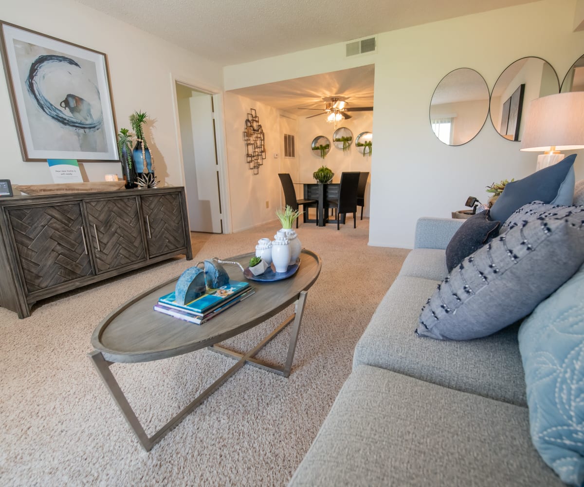 Well-lit living room at Riverpark Apartments in Tulsa, Oklahoma