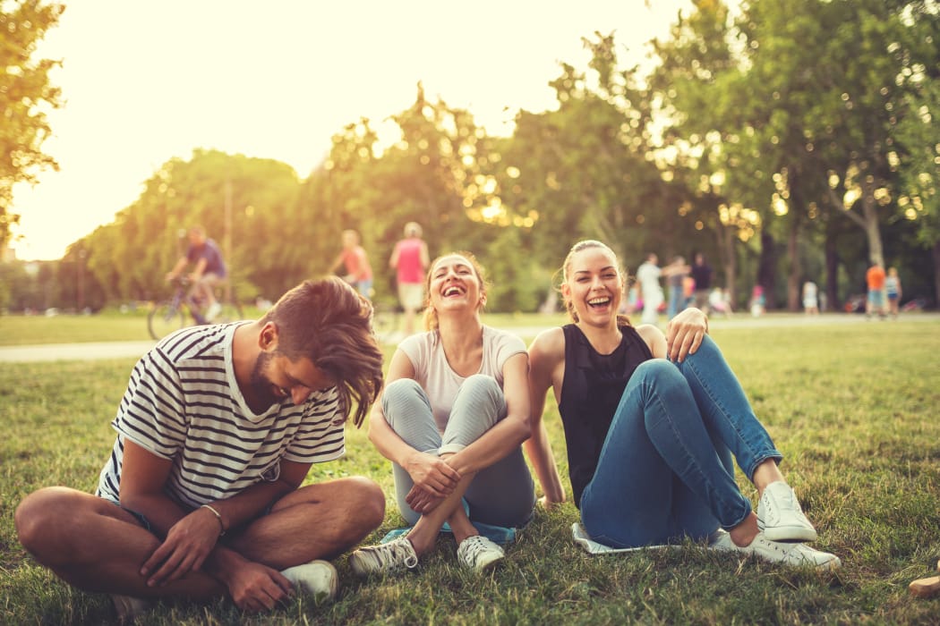 Friends having fun outdoors at Portofino Apartments in Wichita, Kansas
