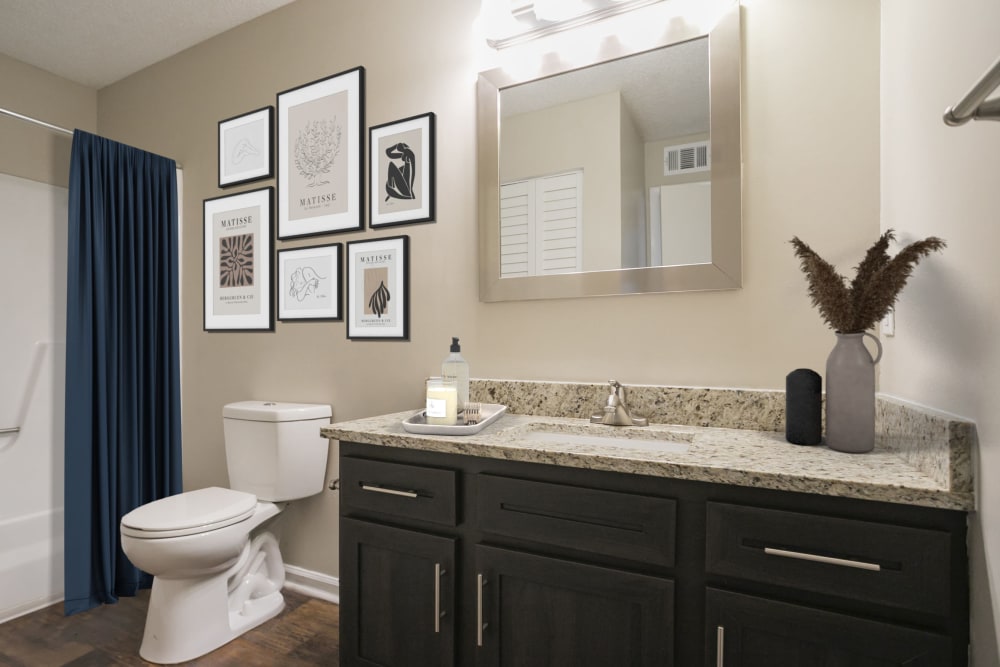 Full bathroom featuring bathtub and shower combo at Magnolia Place Apartments in Franklin, Tennessee
