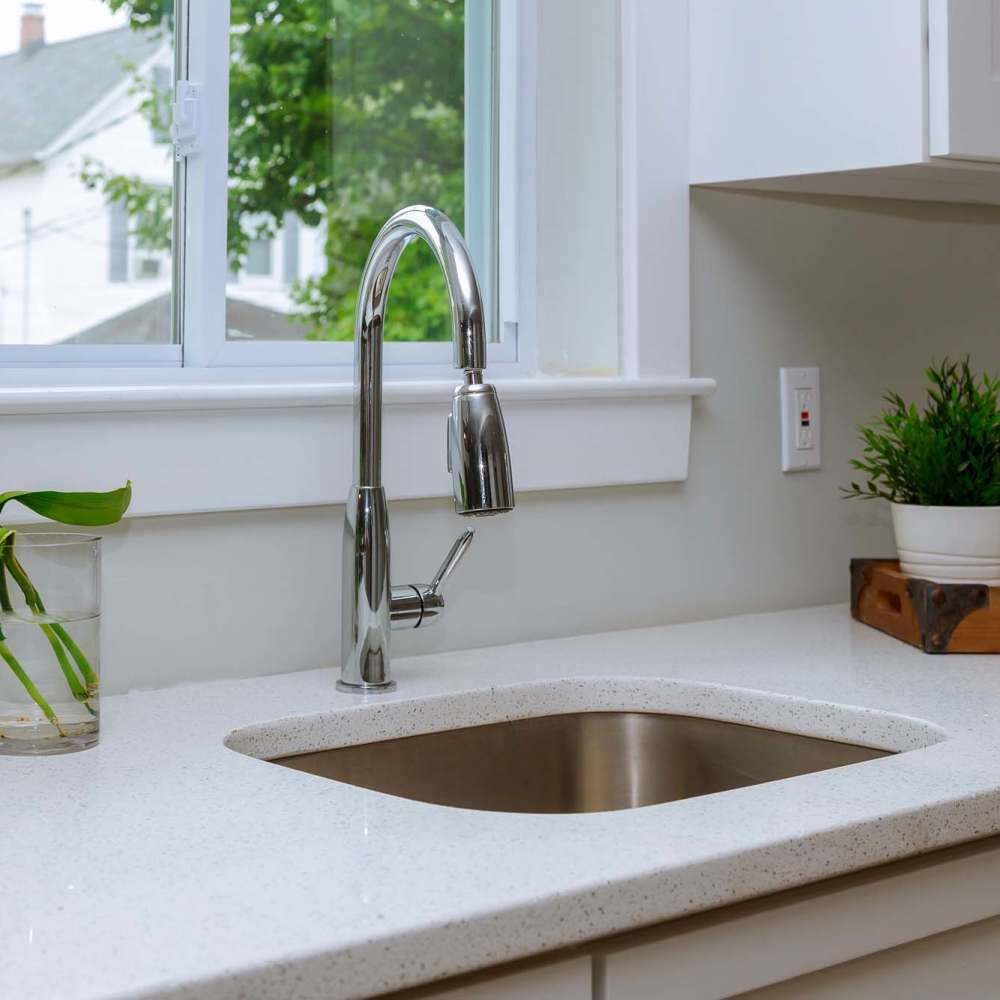 Waterfall sink with granite countertop at Bana At Tujunga in Tujunga, California