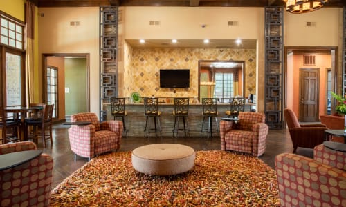 Community area with bar at Woodland Hills in Humble, Texas