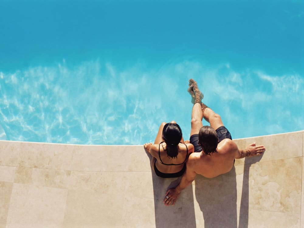 Residents relaxing poolside at Montecito Apartments in Santa Clara, California
