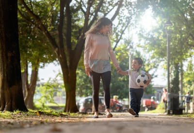Resident mom walking her son to school near Runaway Bay Apartments in Virginia Beach, Virginia