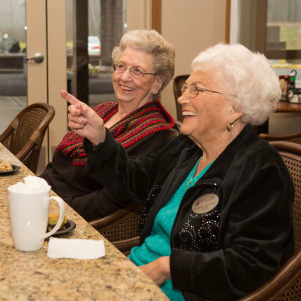 Two residents ordering food at Quail Park at Browns Point in Tacoma, Washington