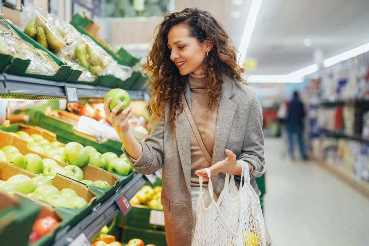 Resident buying grocery near Hampton Village in Palestine, Texas