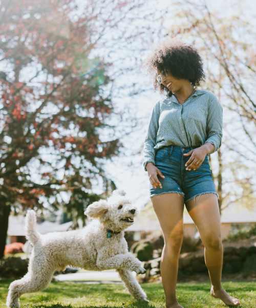 Resident playing with her dog at Ironwood Greens in Gresham, Oregon