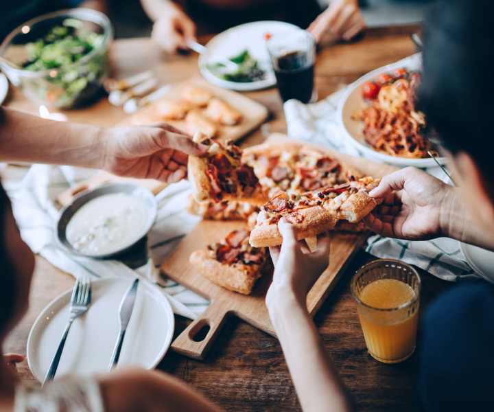 Residents sharing pizza at a restaurant near Signal Hill Apartments in Mechanicsville, Virginia