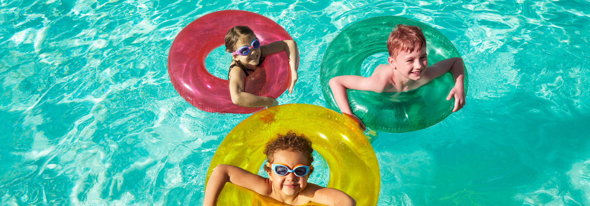 Kids playing in the pool at Las Casas at Windrose in Litchfield Park, Arizona