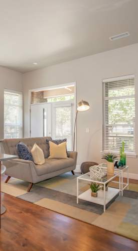Living room with a large window at Park Place Olde Town Apartments in Arvada,Colorado