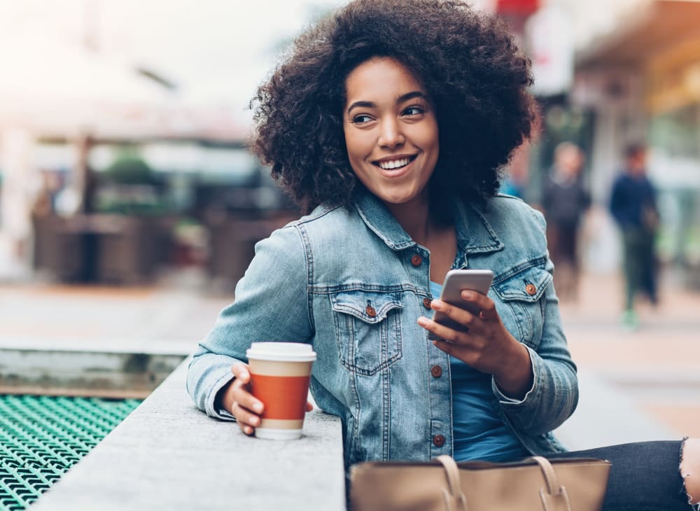 A woman takes a coffee break near Kestrel Park in Vancouver, Washington