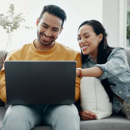 Couple using a laptop in their home at Landmark at Dublin in Dublin, Pennsylvania