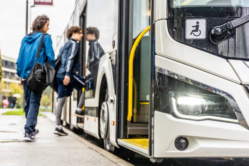 Kids heading towards a school bus near Belmont Glen Residences in Belmont, California