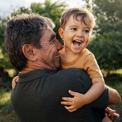 Resident holding his granddaughter at The Residences at Thomas Circle in Washington, District of Columbia 