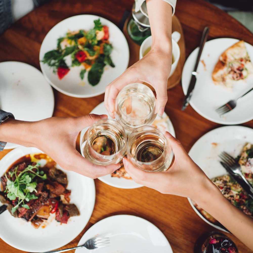 Residents having drinks at a restaurant near Everett House Apartments in Charlotte, North Carolina