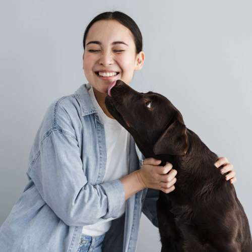 Happy resident with her dog at Truckee River Terrace in Reno, Nevada