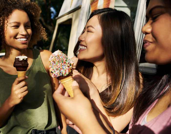 A group of residents eating ice cream near Fairfield Crossing Apartments in Falls Church, Virginia