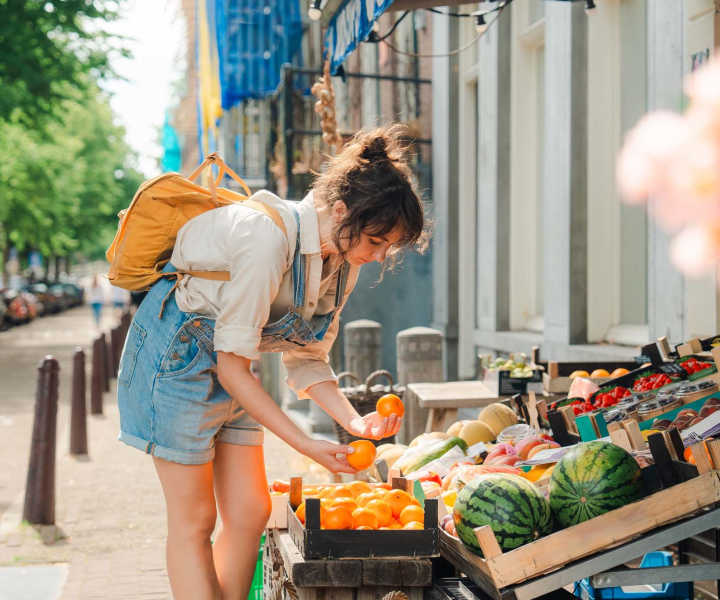 Resident buying groceries at a local mart near Sunset Bay Apartments in Cutler Bay, Florida