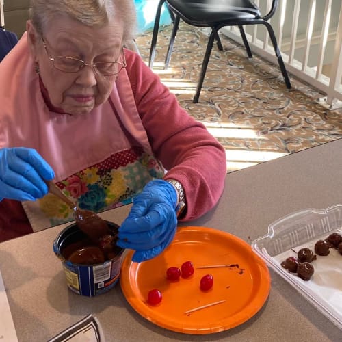 A resident crafting at Canoe Brook Assisted Living & Memory Care in Catoosa, Oklahoma