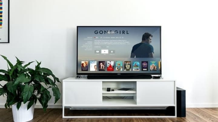 Flat Screen TV in modern stylized living room | Photo by Jens Kreuter on Unsplash