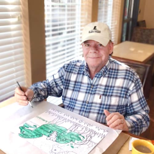 Resident painting at Oxford Glen Memory Care at Grand Prairie in Grand Prairie, Texas